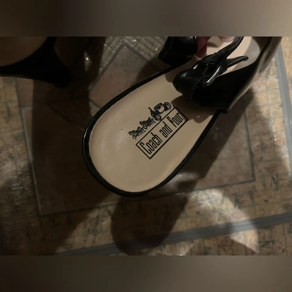 Coach and four Black heels